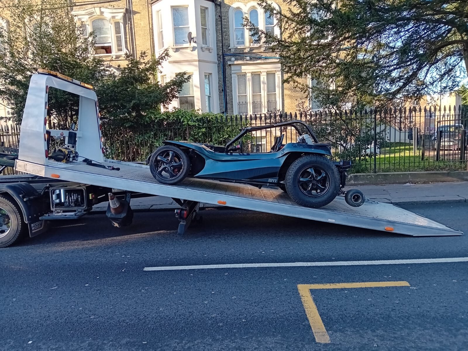 A classic car secured on our flatbed
